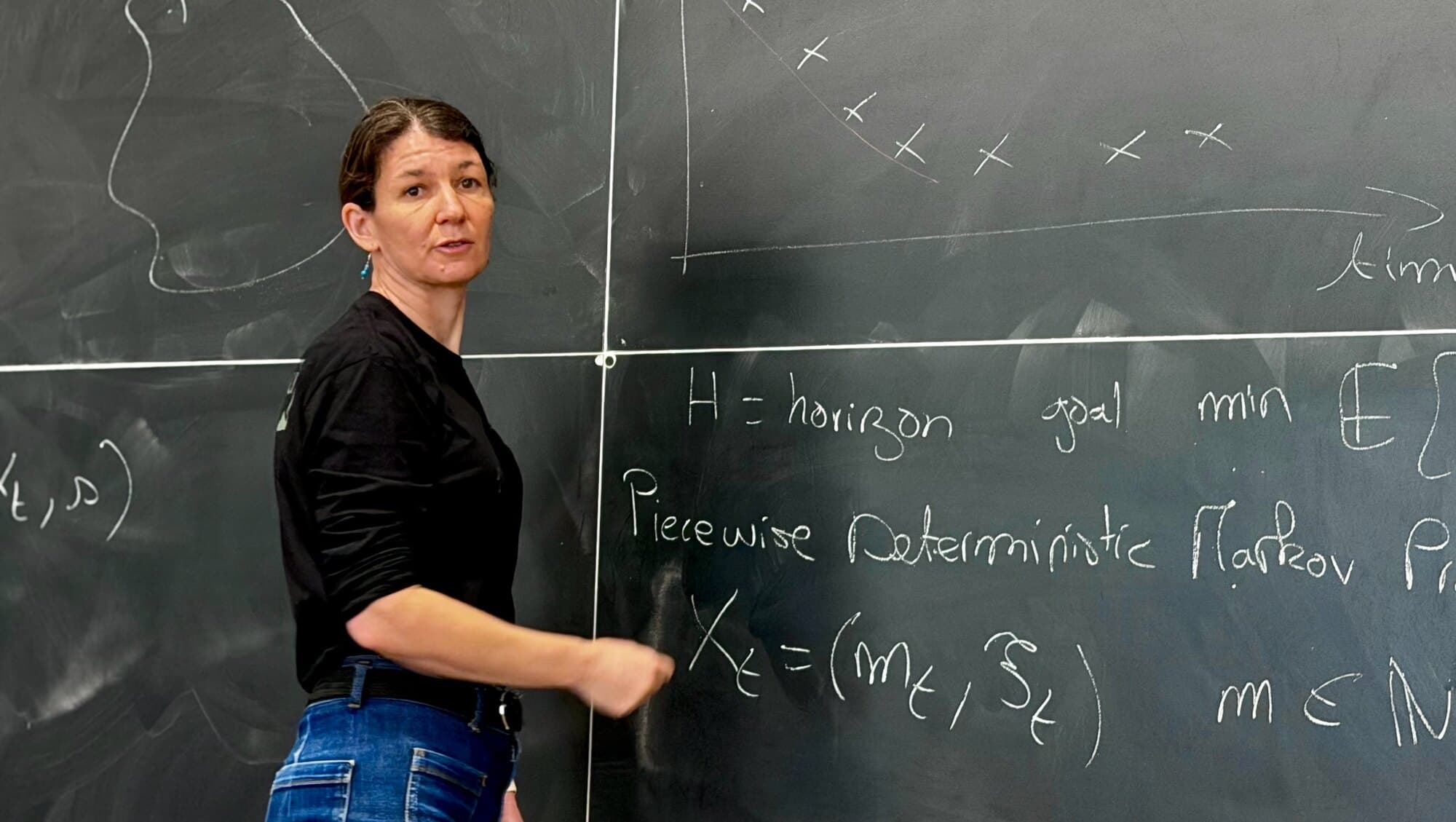 Alice Cleynen at a blackboard, working through a piecewise deterministic Markov process